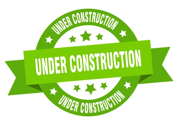 Ruban en construction. en construction ronde signe vert. en construction — Image vectorielle