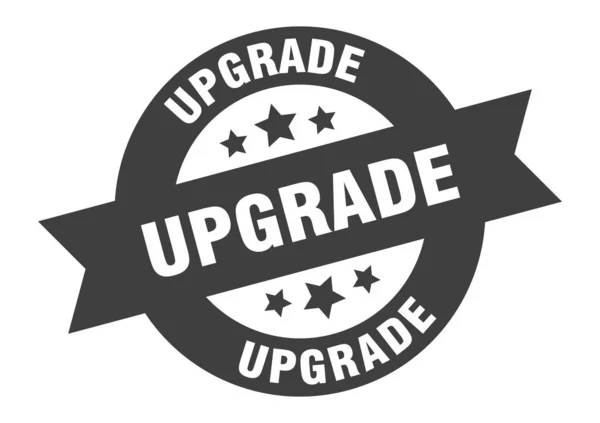 Upgrade-Zeichen. Upgrade schwarzer Aufkleber mit rundem Band — Stockvektor