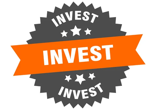 Investiční znamení. investovat oranžovo-černý kruhový štítek — Stockový vektor