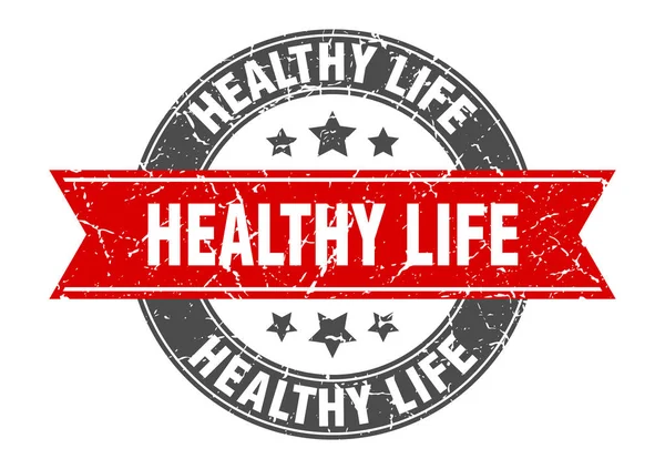 Gesundes Leben Rundstempel mit roter Schleife. Gesundes Leben — Stockvektor