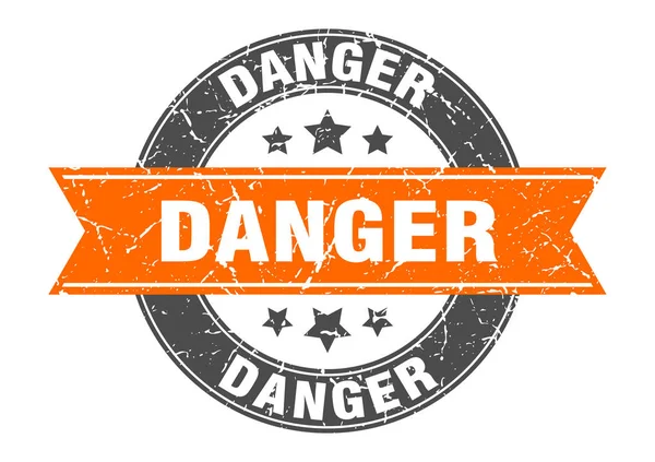 Pericolo timbro rotondo con nastro arancione. pericolo — Vettoriale Stock