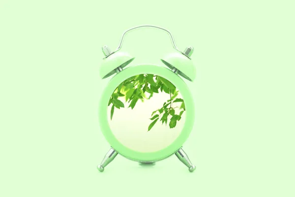 Concepto Primavera Reloj Despertador Verde Con Hojas Verdes Sobre Fondo —  Fotos de Stock
