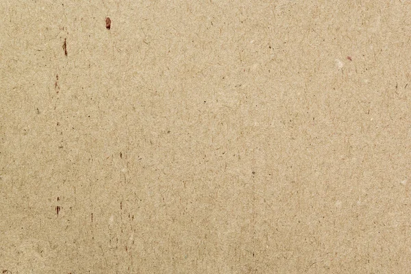 Recycled craft paper texture. Brown cardboard sheet paper