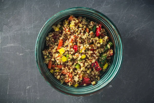 Quinoa salad bowl with colorful vegetables: green beans, carrot, corn, bell pepper, peas. Healthy diet, vegan food concept. Top view, flat lay, copy space.