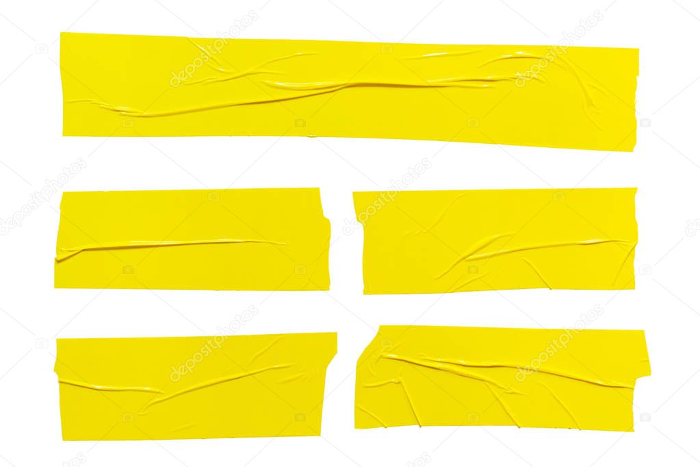 Set of  different size yellow sticky adhesive tapes. Torn crumpled sellotape pieces collection isolated on white background
