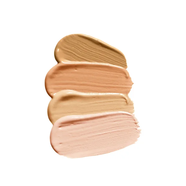 Make up foundation swatch various shades. Liquid foundation smear isolated on white background. Beige nude face cosmetic cream product smudge.