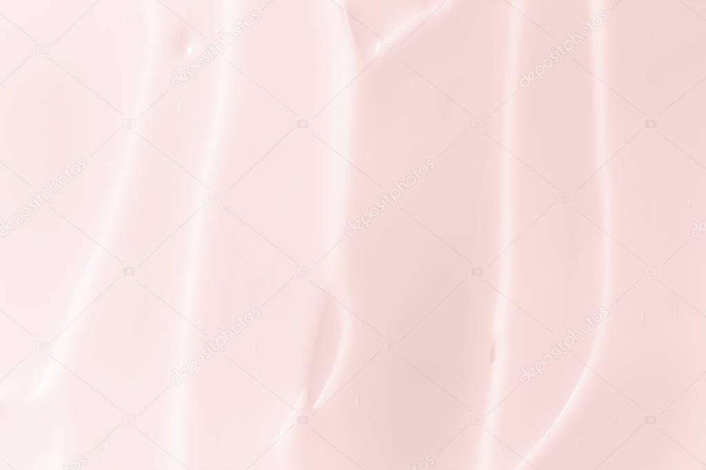 Light pink cosmetic cream texture. Lotion, skin care background. 