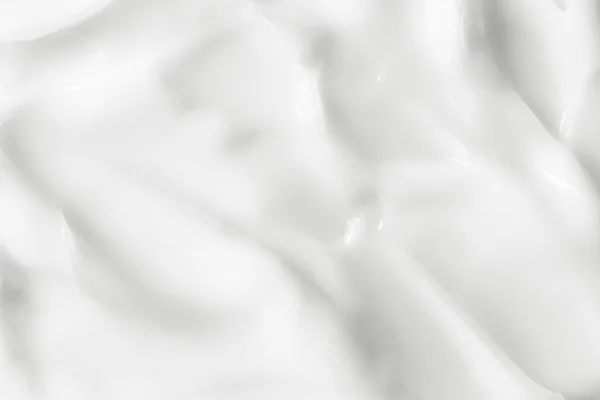 Krem doku. Beyaz kozmetik losyon arka plan. Güzellik merhemle lekesi, yayma