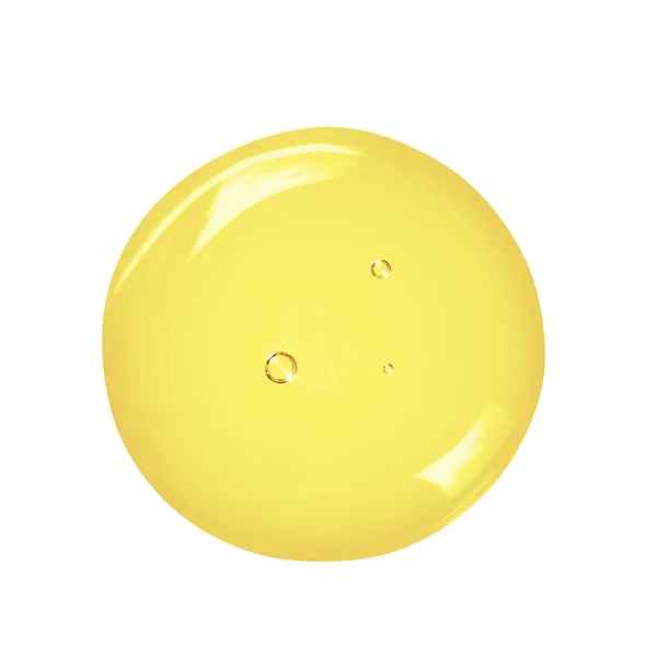 Güzellik yağı serumu beyaza düşer. Baloncuklu sıvı jel yakın çekim. Cilt ürünleri makro fotoğrafçılık