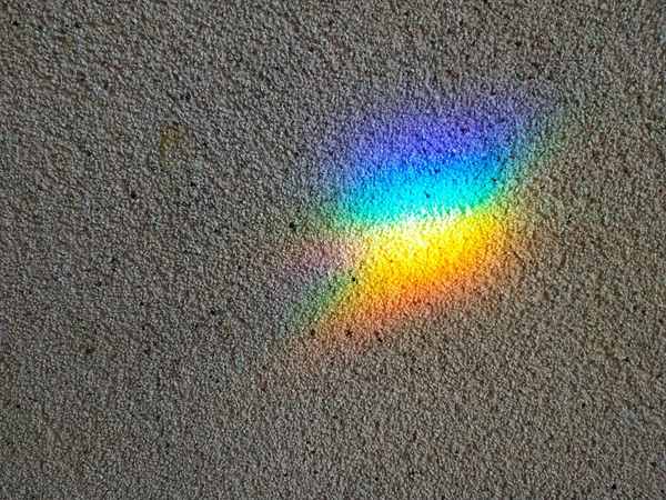 O fundo da parede em que o arco-íris mancha. Gradiente de arco-íris — Fotografia de Stock