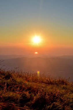 The capturing of the sunrise on the mountain chain Gran Sasso located in the National Park Gran Sasso in Prati di Tivo, Teramo province, Abruzzo region, Italy clipart