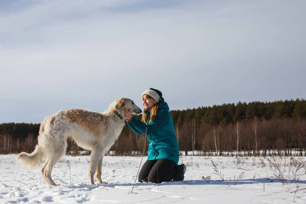 Girl Green Ski Jacket Her Knees Russian White Hound Snowy — Stock Photo, Image