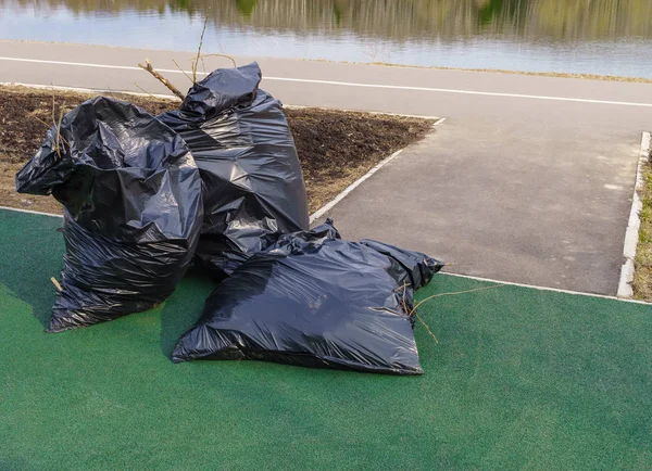 Pile Closed Bags Garbage Lying Next Cleaned Trash Pedestrian Area — Stock Photo, Image