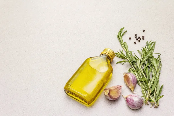 Cooking food background. Fresh rosemary, garlic clove, olive oil, black pepper