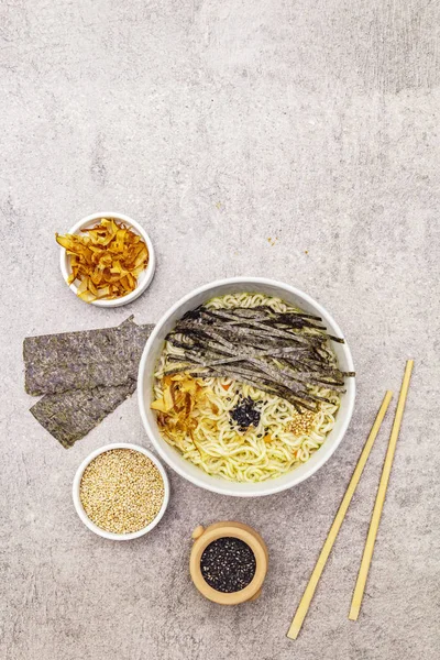 Noodles with seaweed, tuna flakes and sesame seeds