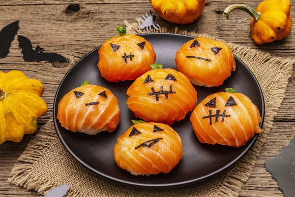 Funny Halloween Sushi Pumpkins Jack o Lantern, Sushi Monsters. Temari sushi, sushi balls. Healthy food for kids