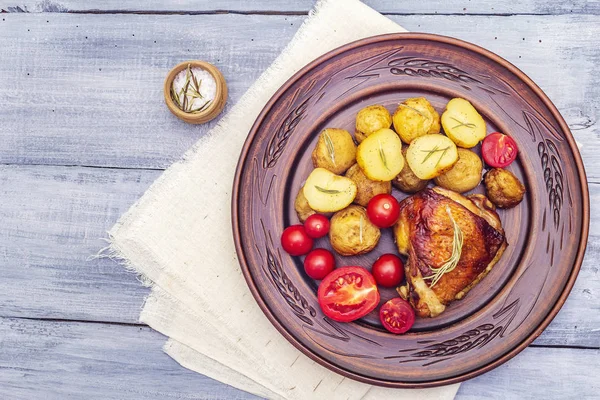 Roast chicken thighs and baby potatoes — Stock Photo, Image