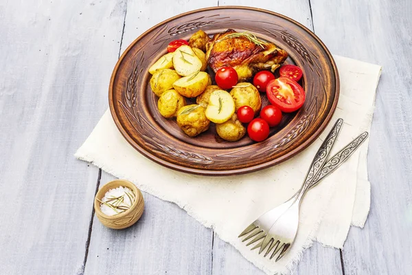 Roast chicken thighs and baby potatoes — Stock Photo, Image