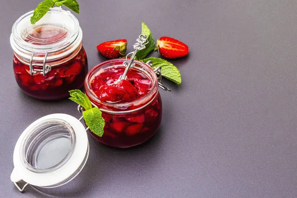 Strawberry jam in a glass jar. — Stock Photo, Image