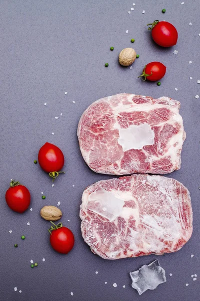 Frozen raw pork steak — Stock Photo, Image