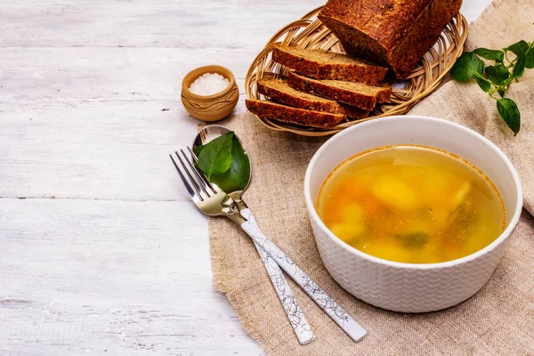 Trout soup with cutting vegetables and toasted bread. Traditional hot fish soup for healthy lifestyle. White wooden boards background, copy space — Stock Image Trout Soup Cutting Vegetables Toasted Bread Traditional Hot Fish Soup Stock Image
