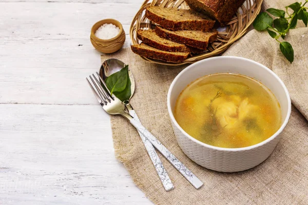 Trout soup with cutting vegetables and toasted bread. Traditional hot fish soup for healthy lifestyle. White wooden boards background, copy space — Stock Image Trout Soup Cutting Vegetables Toasted Bread Traditional Hot Fish Soup Royalty Free Stock Images
