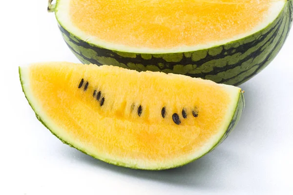 Slice of yellow watermelon isolated on a white background