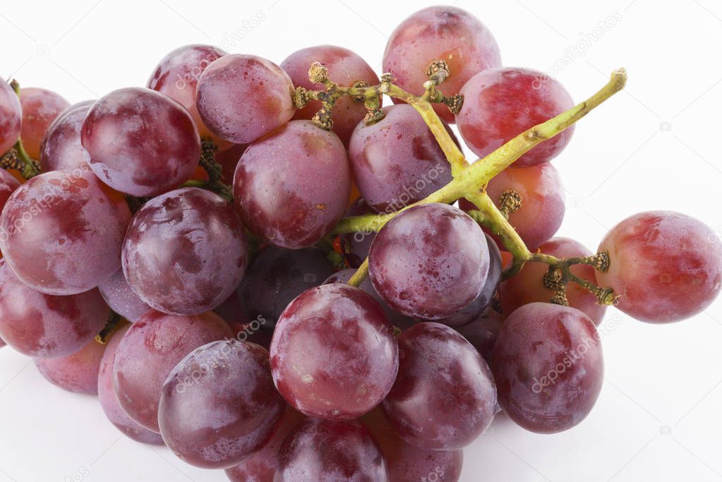 Ripe red grape isolated on white background.