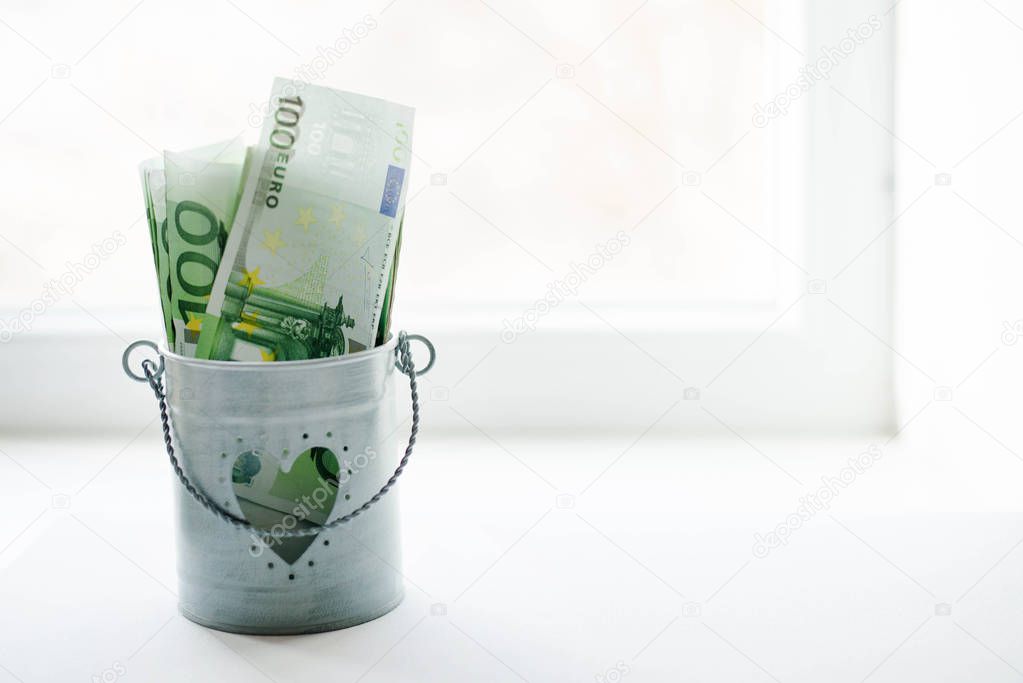 Bucket Filled with Lots of Money euro Isolated on White Background.