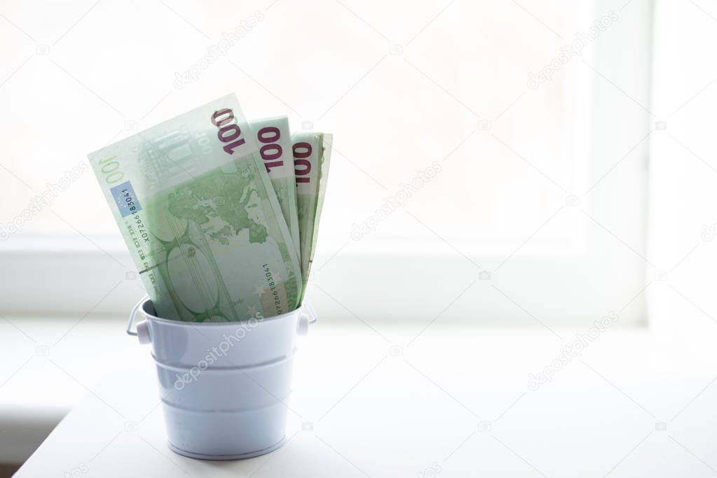 Bucket Filled with Lots of Money euro Isolated on White Background.