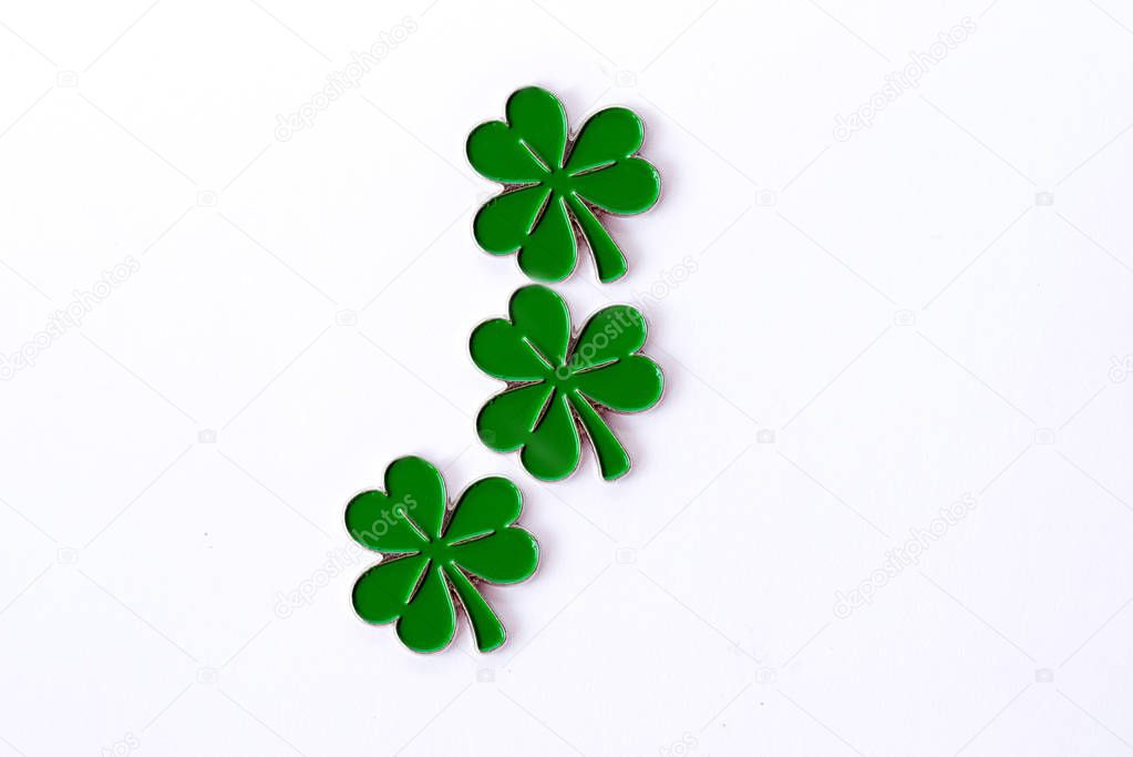 Background for St. Patrick's day. for design with clover. Clover isolated on white background. Irish symbols of the holiday. There is room for text.