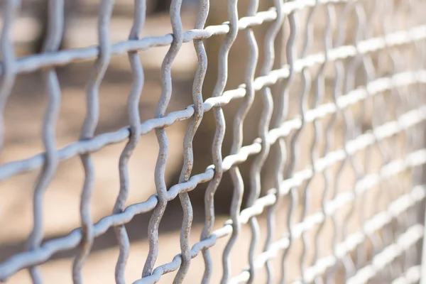 Metal chain-link fence on a background close-up — Stock Photo, Image