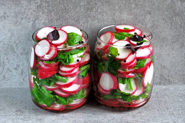 Salad in the jar. Fitness salad with radish and spinach. Food containing fiber.