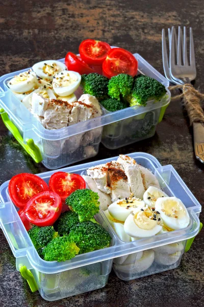 Lunch boxes with a healthy meal. Vegetables, quail eggs and chicken breast. Lunch boxes to go.