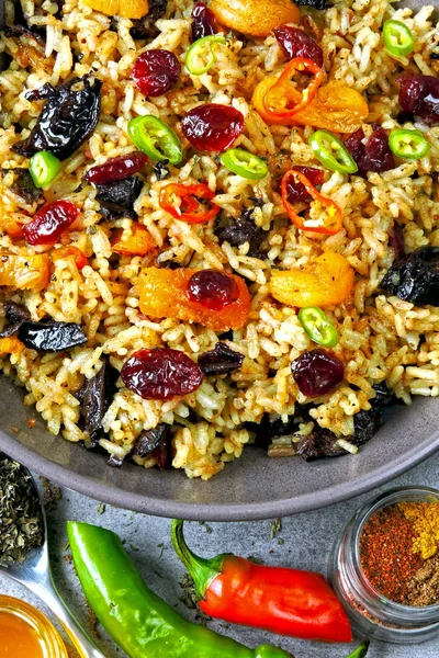 Spicy rice with spices and dried fruits. Vegan bowl. Healthy eating rice with spices. Food for weight loss.