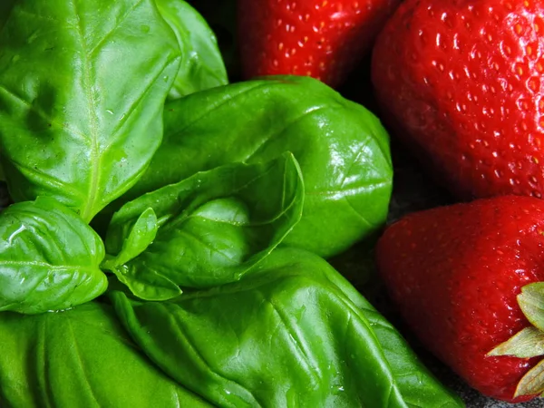 Strawberries and basil. Right combination of products. Products for weight reduction. Macro.