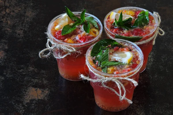 Fresh homemade raspberry mint lemonade. Refreshing summer lemonade with raspberries and mint. Homemade fruit lemonade in a cup. Raspberry lemonade. Rustic style.  Keto diet. Keto drinks.