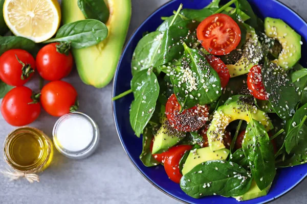 Healthy salad with avocado, spinach and cherry tomatoes. Vegan Salad. Super food. Healthy diet.