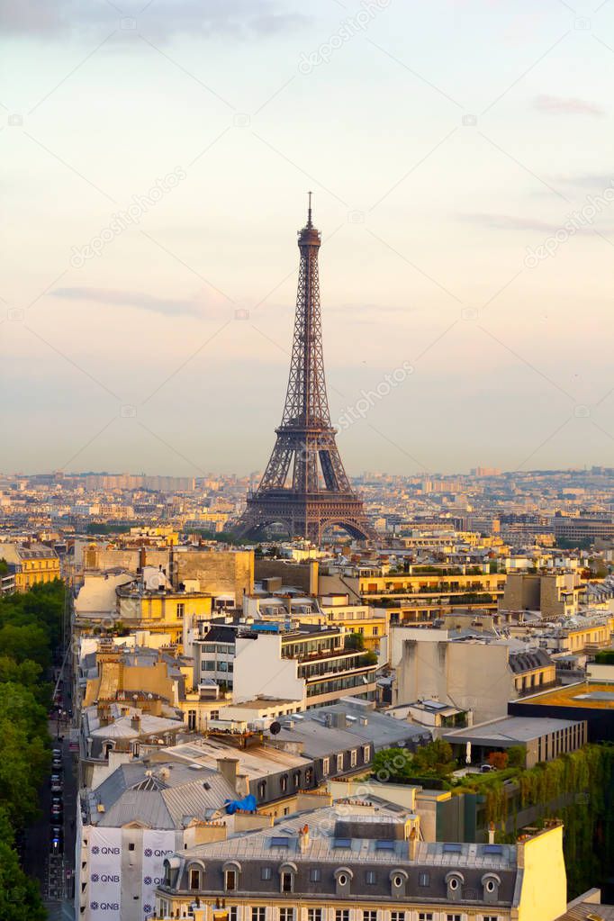 Aerial view of Paris skyline with Tour Eiffel in background.