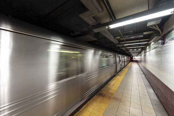 New York Subway train in transit in the station.