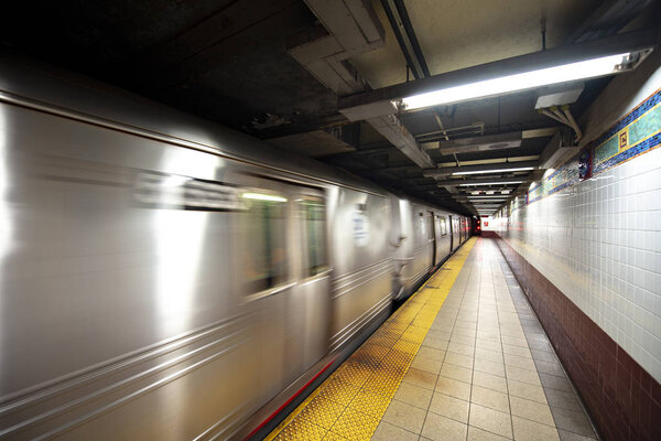 New York Subway train in transit in the station.