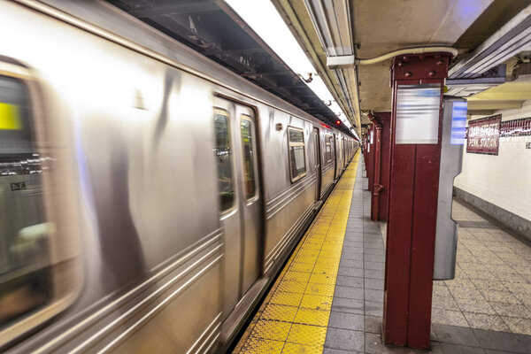 New York Subway train in transit in the station.