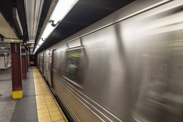 New York Subway train in transit in the station.