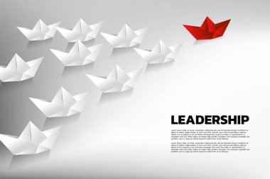 Kırmızı origami kağıt gemi beyaz grup lider. Takım liderliği İş Kavramı.