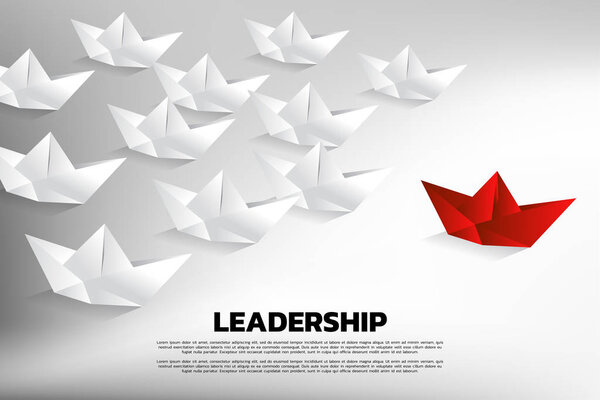 Red origami paper ship leading the group of white. Business Concept of team leadership.
