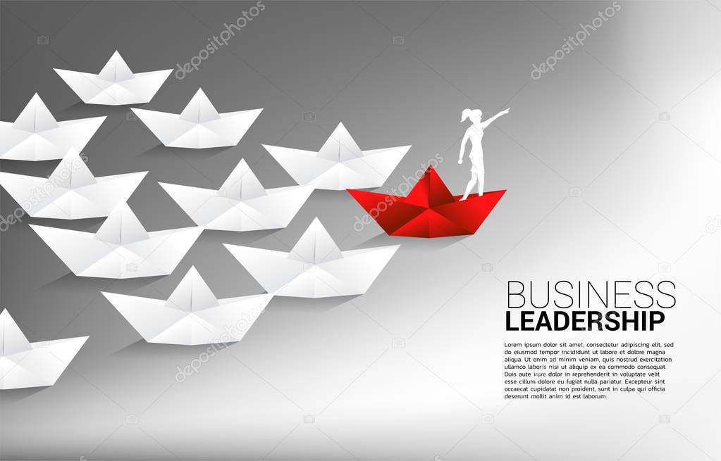 silhouette of businessman point forward on red origami paper ship leading group of ship. Business Concept of leadership and vision mission.