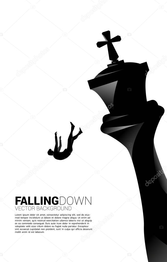 Silhouette of businessman falling down from the king chess. concept of business strategy and fail situation.