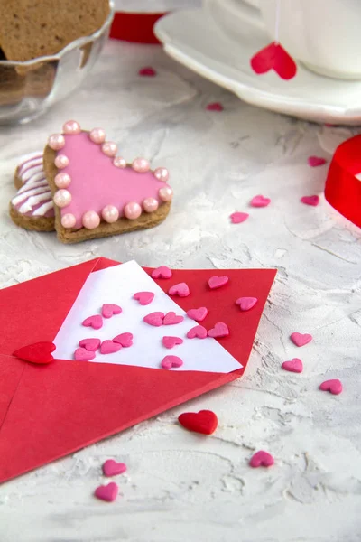 Tea with cookies heart shaped Red ribbon Red letter with candy Selective Focus White Background branch Christmas tree Vertical