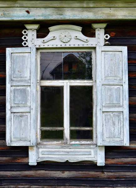 The window of an old house in which people no longer live