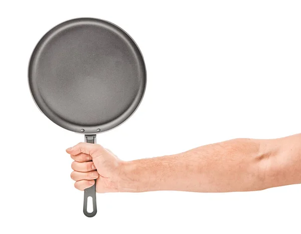 Hand holding a black frying pan isolated on white background — Stock Photo, Image